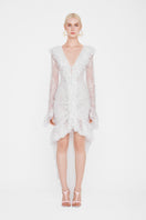 Valenciani Seraphina ruffle high-low white midi dress displayed on a hanger, showcasing its flowing fabric and ruffle details.