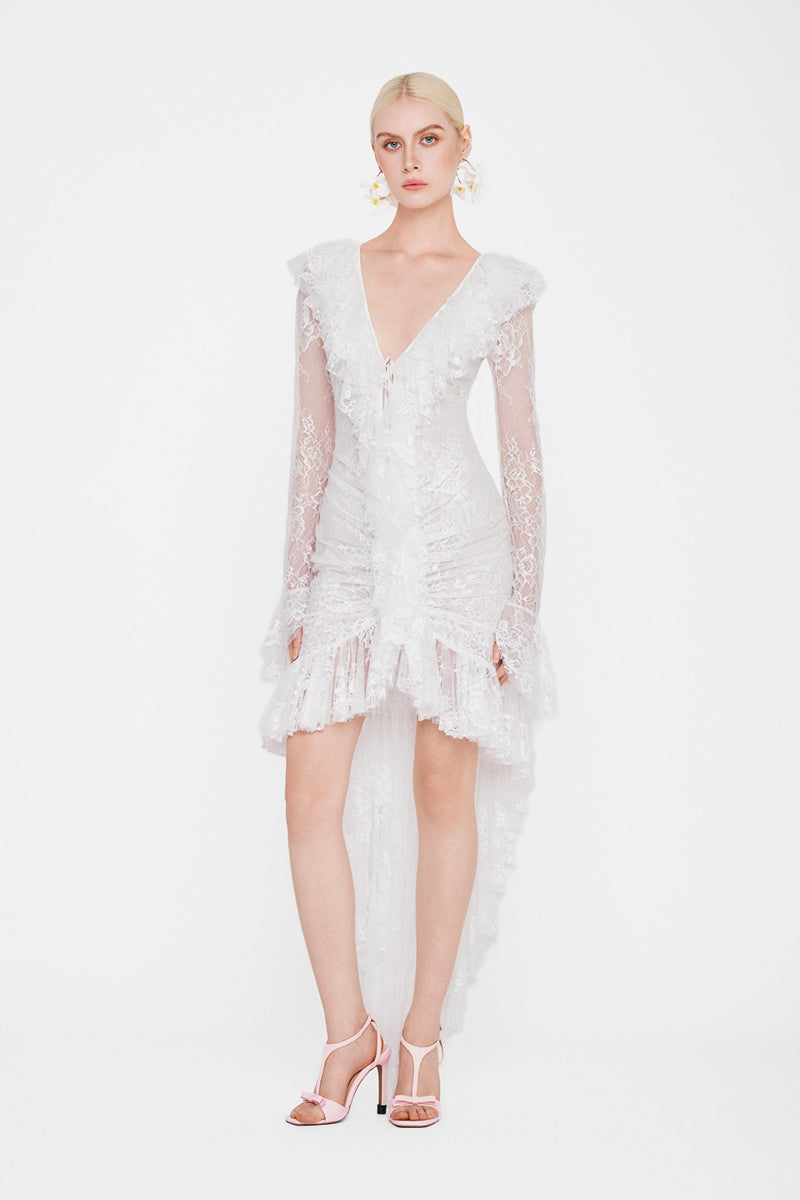 White Seraphina Ruffle High-Low Midi Dress by Valenciani, showcasing flowing ruffle details and elegant high-low hem.