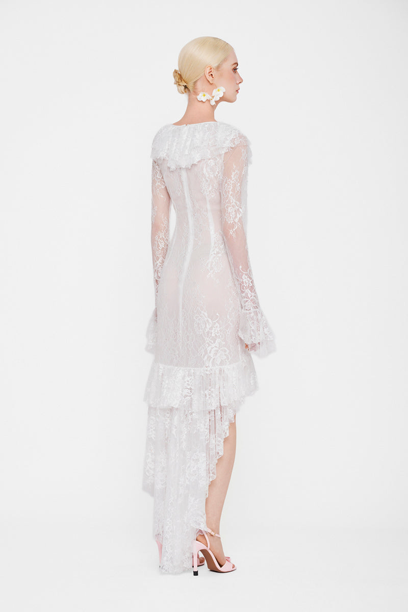White Seraphina Ruffle High-Low Midi Dress by Valenciani featuring ruffled details and a flowing high-low hem.