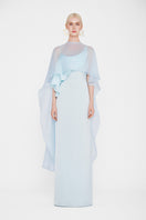 Valenciani Galatea Cape Gown in Ice Blue, elegant maxi dress with flowing fabric and cape detail, perfect for formal occasions.
