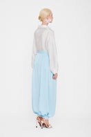Sky blue balloon pants by Valenciani, featuring a relaxed fit and unique balloon silhouette, displayed on a mannequin.