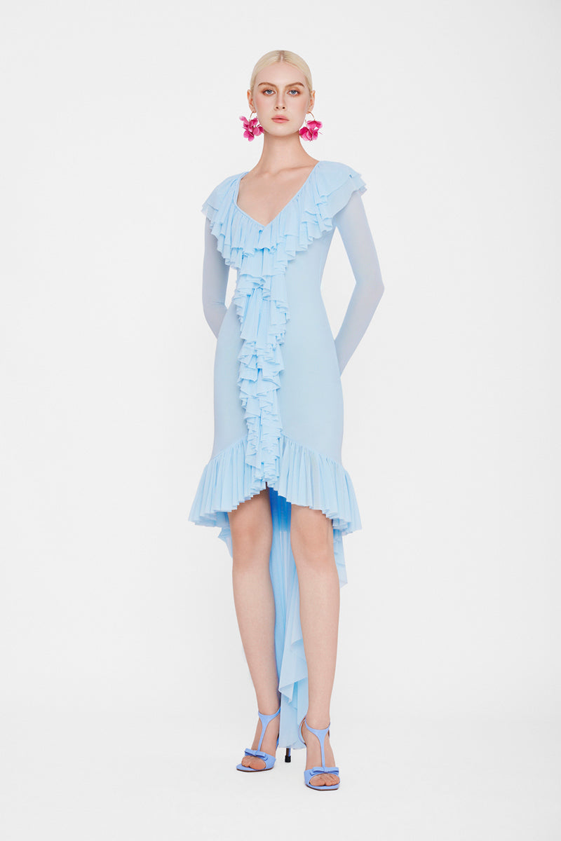 Valenciani CULT MIA X VALENCIANI The Seraphina ruffle high-low midi dress displayed on a hanger, featuring ruffled details and flowing fabric.