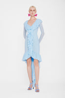 Valenciani CULT MIA X VALENCIANI The Seraphina ruffle high-low midi dress displayed on a hanger, featuring ruffled details and flowing fabric.
