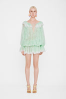 Valenciani off-shoulder lace mini dress displayed on a mannequin, featuring delicate lace fabric and a fitted silhouette.