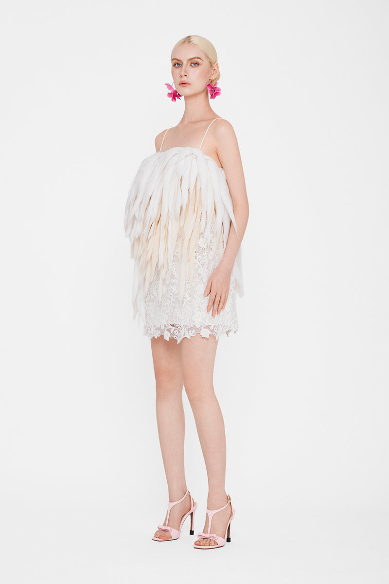 Valenciani Jelly Fish mini dress in white, lightweight fabric with a fitted bodice and flared skirt, displayed on a hanger.