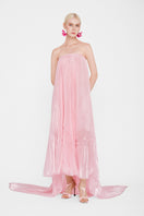 Valenciani strapless pastel pink pleated maxi dress displayed on a hanger, showcasing its flowing fabric and elegant design.