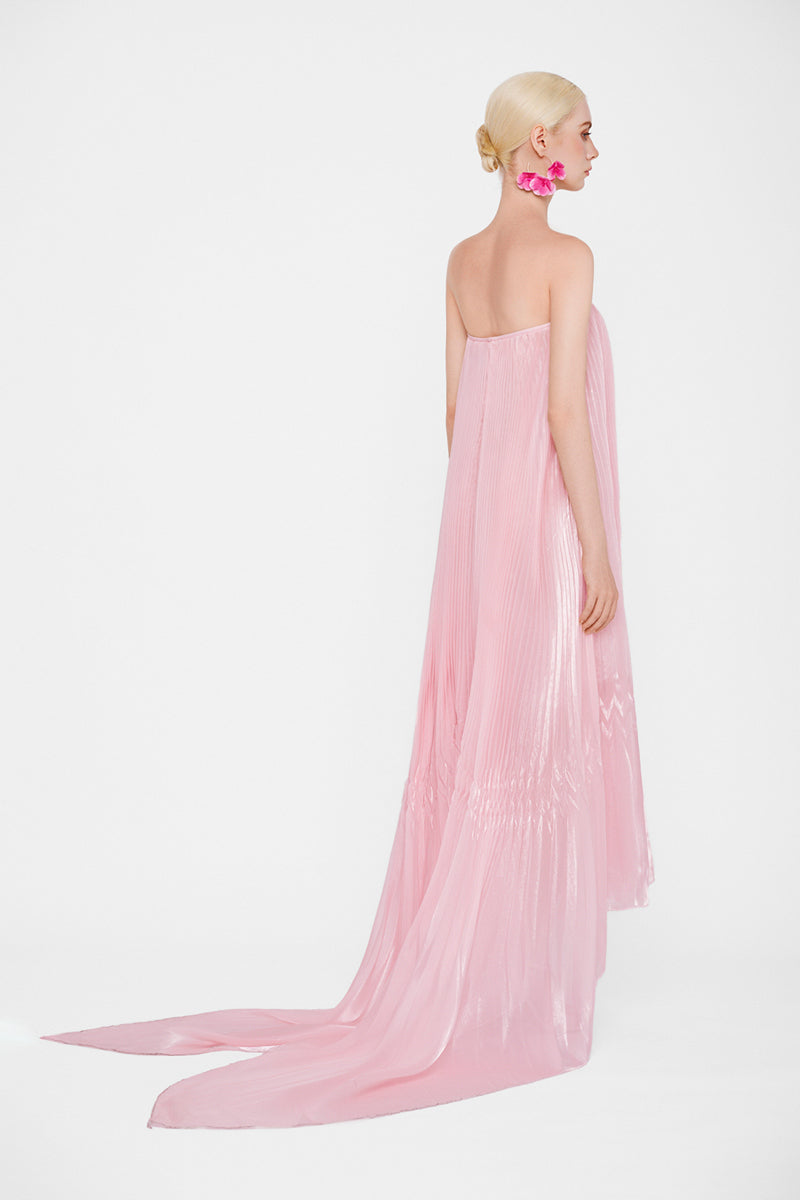 Pastel pink strapless pleated maxi dress by Valenciani, flowing fabric with a fitted bodice and elegant length.