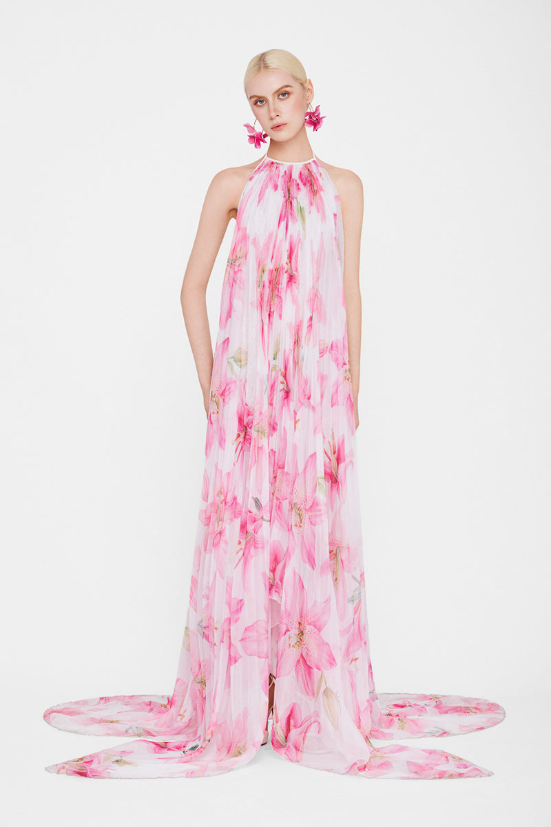 Multicolor Valenciani halter neck pleated maxi dress displayed on a mannequin with flowing fabric and vibrant pattern.