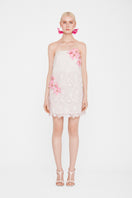 White strapless mini lace dress by Valenciani, featuring delicate lace details and a fitted silhouette perfect for special occasions.