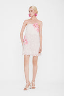 White strapless mini lace dress by Valenciani, featuring delicate lace fabric and a fitted silhouette for stylish occasions.