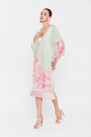 Colorful V-neck midi kaftan dress by Valenciani, featuring a flowing silhouette and vibrant multicolor pattern.