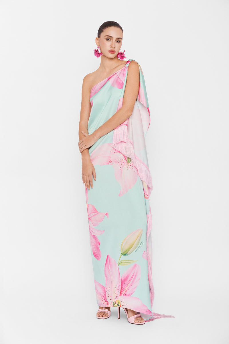 Valenciani multicolor one-shoulder maxi dress displayed on a hanger with flowing fabric and vibrant pattern.
