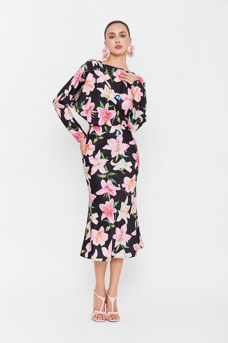 Valenciani long sleeve midi dress in multicolor with a flowing maxi style, featuring vibrant patterns and a fitted waist.