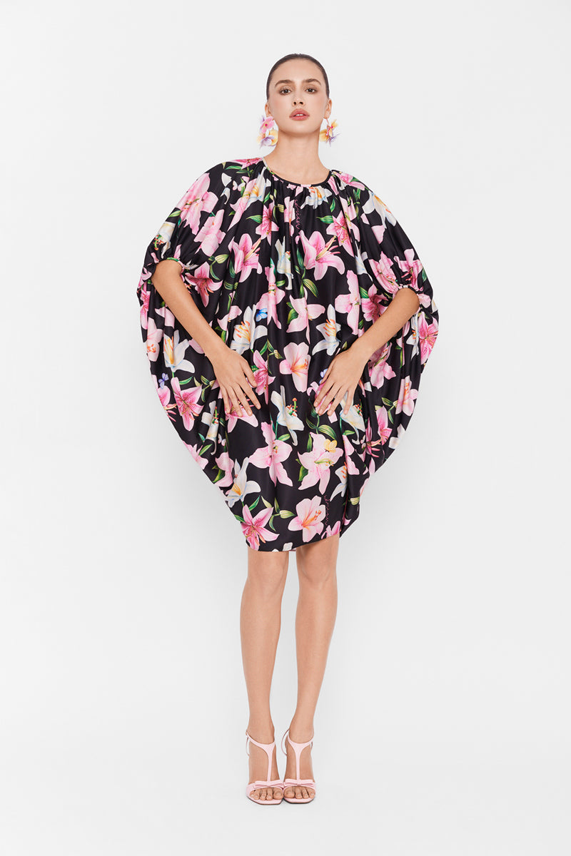 Multicolor balloon dress by Valenciani featuring a playful, vibrant mini dress design with flowing fabric and bold color patterns.
