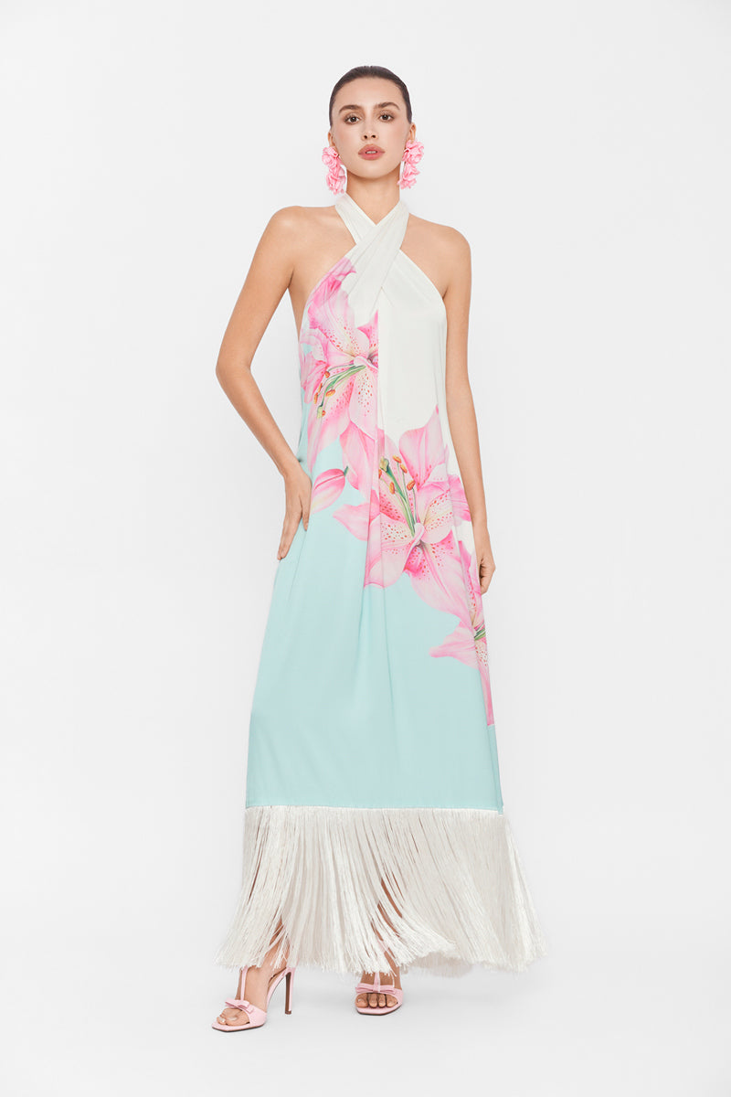 Multicolor Valenciani Riviera halter maxi dress displayed on a hanger, featuring flowing fabric and vibrant pattern.