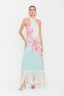 Multicolor Valenciani Riviera halter maxi dress displayed on a hanger, featuring flowing fabric and vibrant pattern.