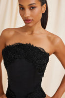 Black Lauren corset top by Scarlett Gasque with lace-up front and fitted design, showcased on a neutral background.
