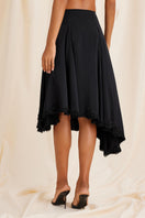 Black Scarlett Gasque Lauren midi skirt shown from the back, featuring a sleek, fitted design and stylish length.