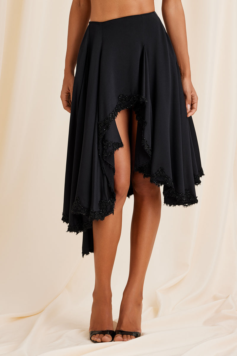 Black Lauren midi skirt by Scarlett Gasque, front view showing lightweight fabric and fitted waist for stylish everyday wear.