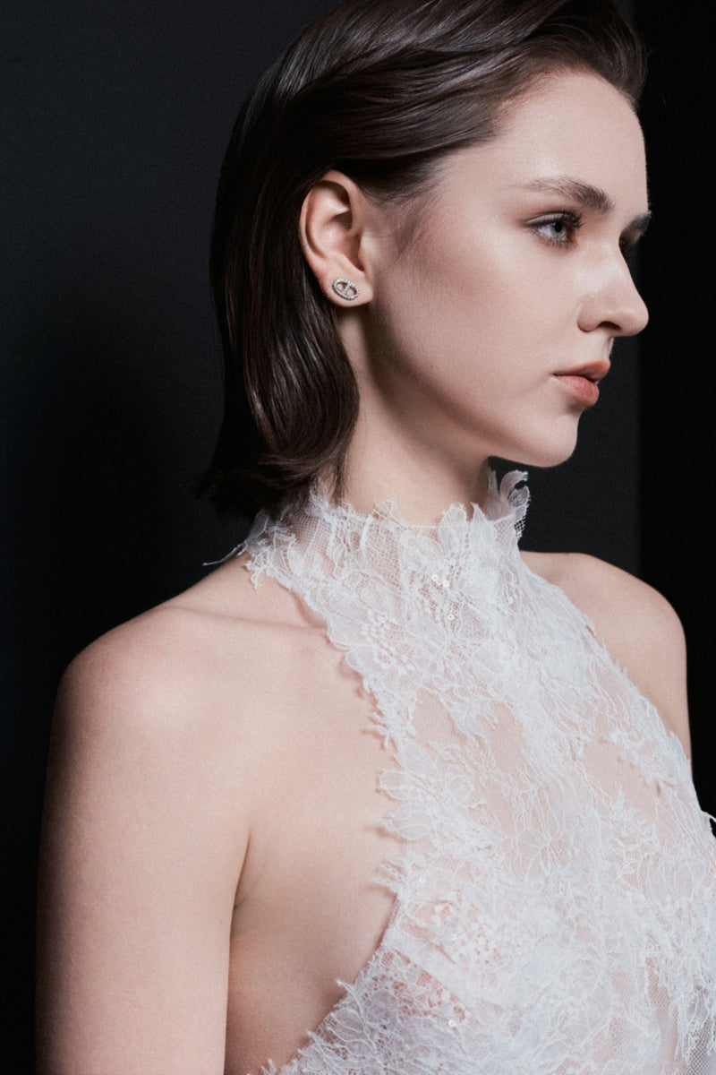 White Bologna top by LEKIEU, stylish sleeveless blouse with a relaxed fit, shown on a model with minimal accessories.