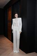 White LEKIEU Florence jacket with a sleek design, shown on a hanger against a neutral background.