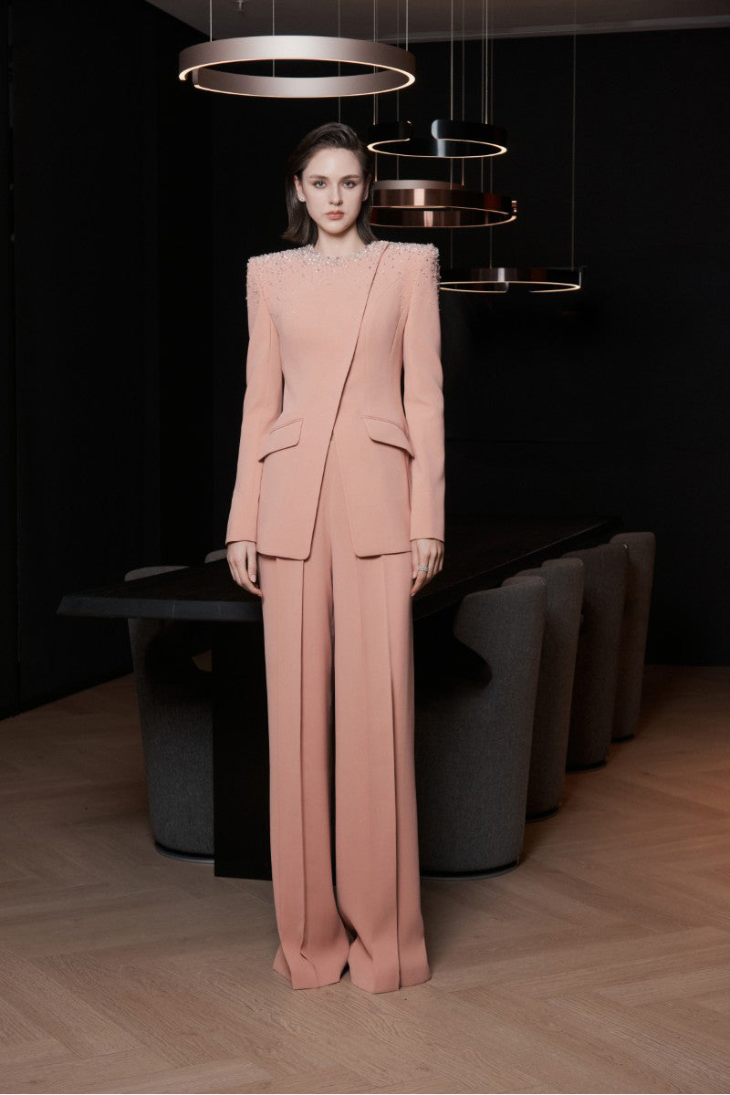 Bright orange LEKIEU Saint-Paul pants with a relaxed fit and stylish design, shown in a high-quality product image.