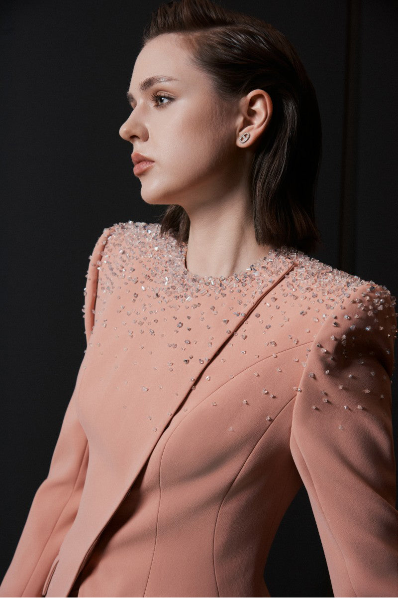 Bright orange LEKIEU PERUGIA jacket displayed on a hanger, showcasing its stylish design and vibrant color.