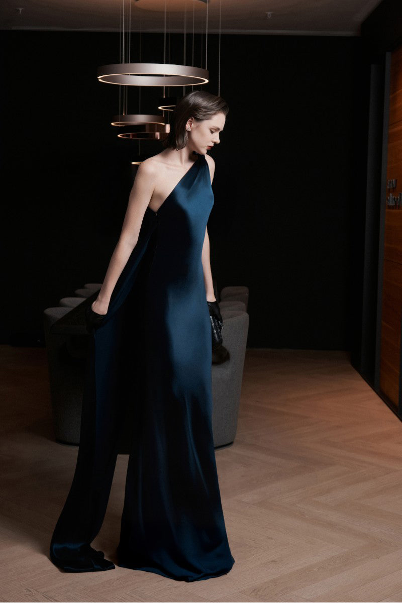 Midnight blue LEKIEU Naples maxi dress displayed on a hanger, showcasing its elegant flowy design and sleeveless style.