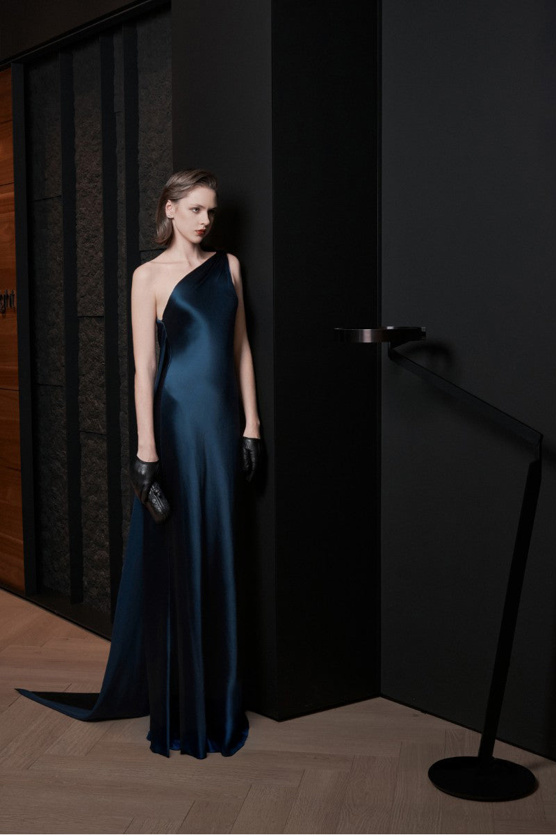 Elegant midnight blue maxi dress by LEKIEU with flowing fabric and a fitted waist, perfect for formal occasions.