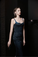 Elegant midnight blue LEKIEU Palermo gown with flowing fabric and fitted bodice, perfect for formal occasions.