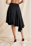 Black Scarlett Gasque Lauren midi skirt displayed from the back, showcasing its sleek design and elegant fit.
