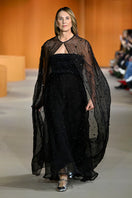 Maxi floral beaded black cape by MASTANI, featuring intricate beadwork and elegant floral patterns, perfect for stylish coats.