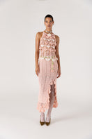 Pink handmade crochet top featuring intricate floral patterns, designed by Andreeva, perfect for casual or boho fashion styles.