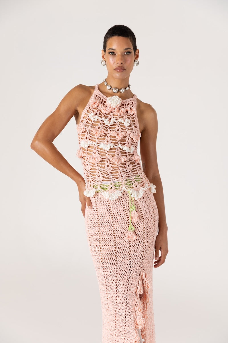 Pink handmade crochet chrysanthemum top by Andreeva, featuring intricate floral knit design and fitted sleeveless style.