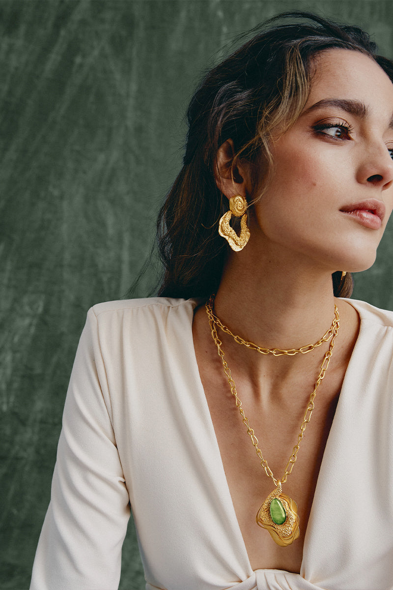 Jude Benhalim Gold Hera Earrings, elegant jewelry with intricate design, showcased on a neutral background.