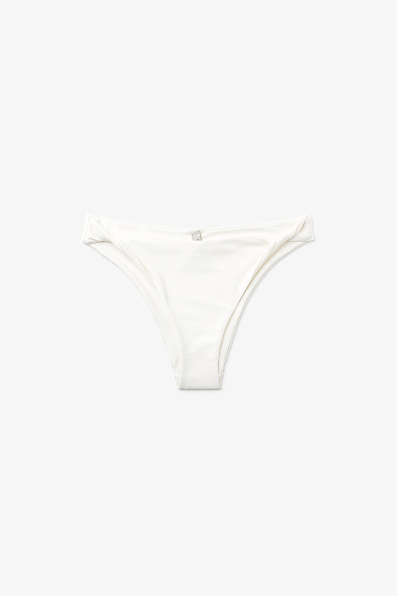 Seaquelle twisted bikini bottom in creme white with knot detail, shown on a model, part of THE KNOT BIKINI collection.