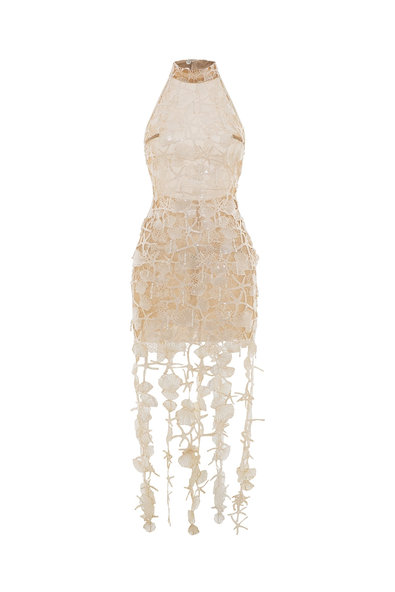 Ivory Valenciani Thalassa halter maxi dress displayed on a model, featuring flowing fabric and elegant design.
