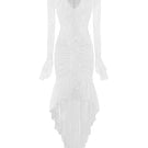 White Seraphina ruffle high-low midi dress by Valenciani, featuring flowing fabric and elegant ruffle details.