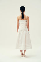 Ivory midi skirt by Chictopia, featuring a flowy design and elegant length, perfect for stylish everyday wear.