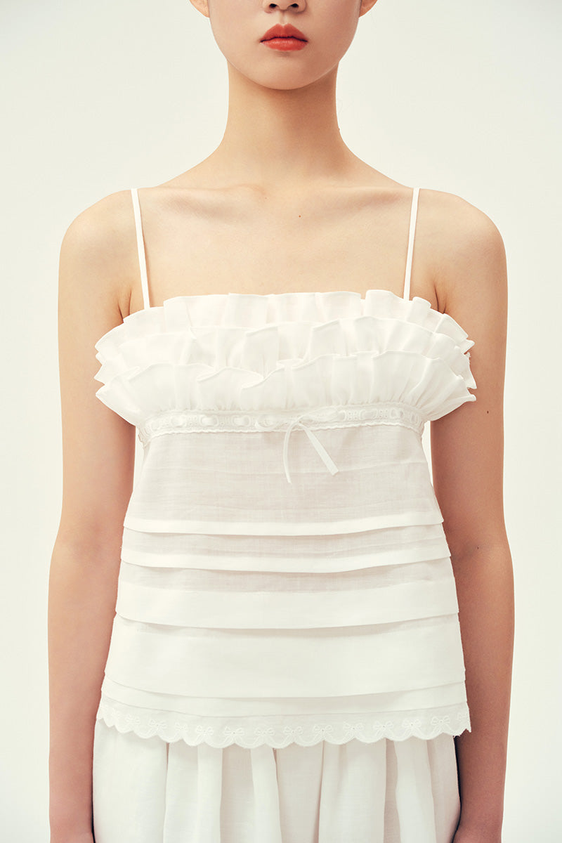 Ivory midi skirt by Chictopia, styled with a flowy silhouette and subtle pleats, perfect for casual or dressy occasions.