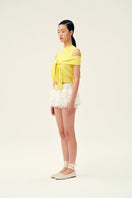 Chictopia Lola Ivory Shorts, lightweight denim with a relaxed fit, displayed on a hanger against a neutral background.