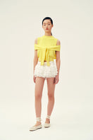 Chictopia Lola Ivory Shorts displayed on a hanger, showcasing lightweight fabric and simple design for casual summer wear.