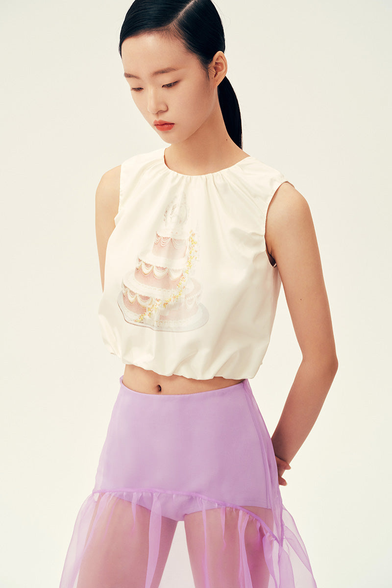 Ivory wedding cake tank top from Chictopia displayed on a mannequin, featuring a stylish sleeveless design perfect for casual wedding attire.
