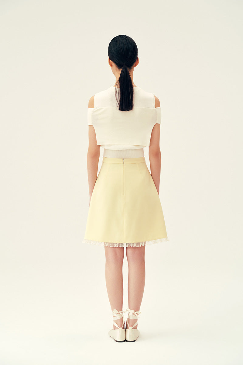 Chictopia Bonnie mini skirt in pastel yellow, lightweight fabric, high waist, and A-line style perfect for spring outfits.
