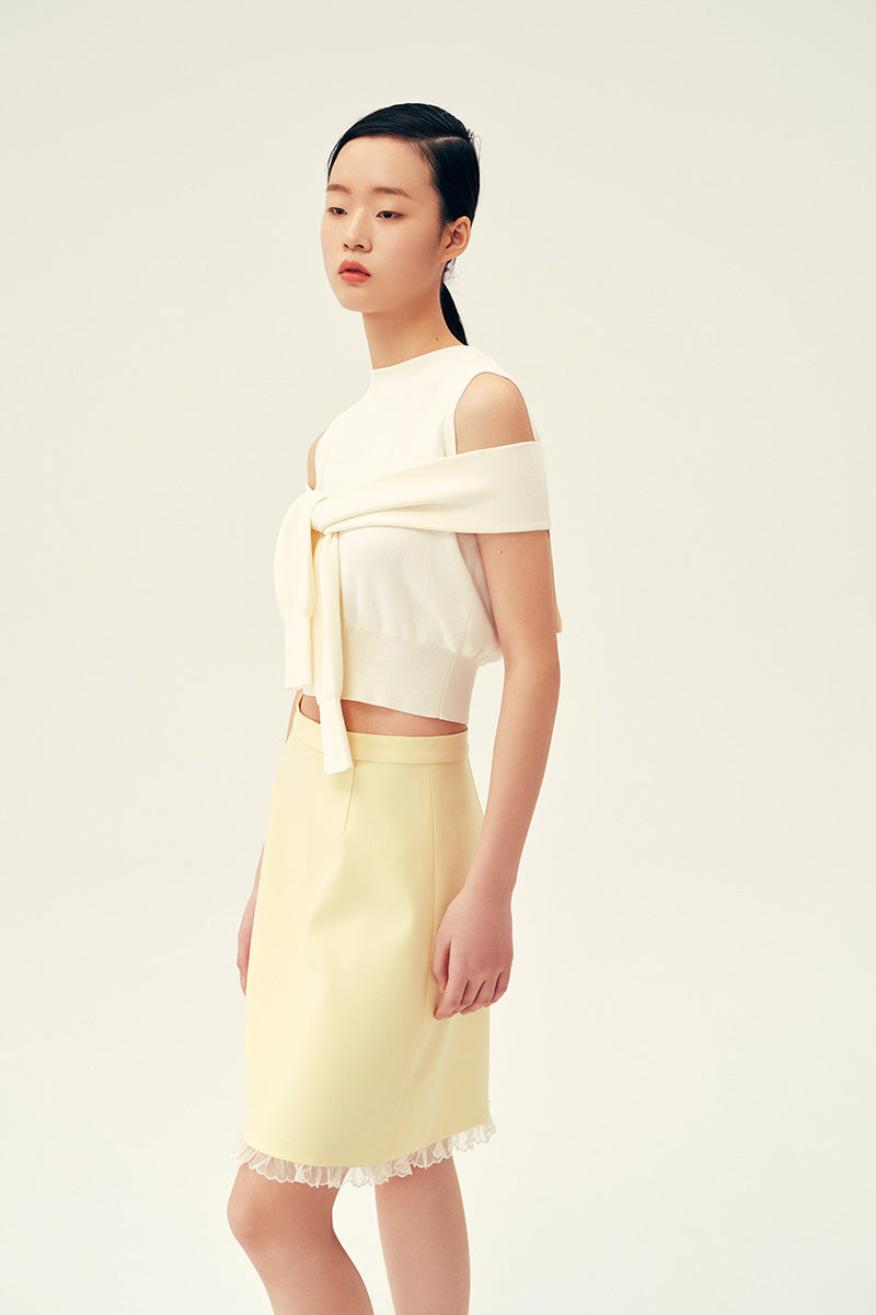 Chictopia Bonnie mini skirt in pastel yellow, lightweight fabric with a fitted waist and stylish short length, ideal for spring outfits.