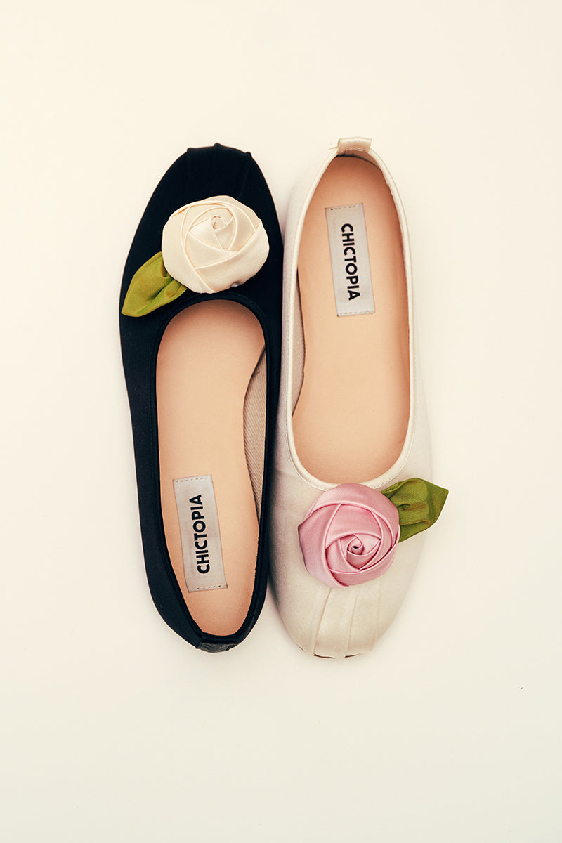 Chictopia satin rose flats in ivory with a delicate bow and floral design, perfect for elegant casual wear.