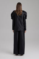 Black blazer by BAÉ, Rose Jet style, featuring a tailored fit, lapel collar, and sleek design for a sophisticated look.