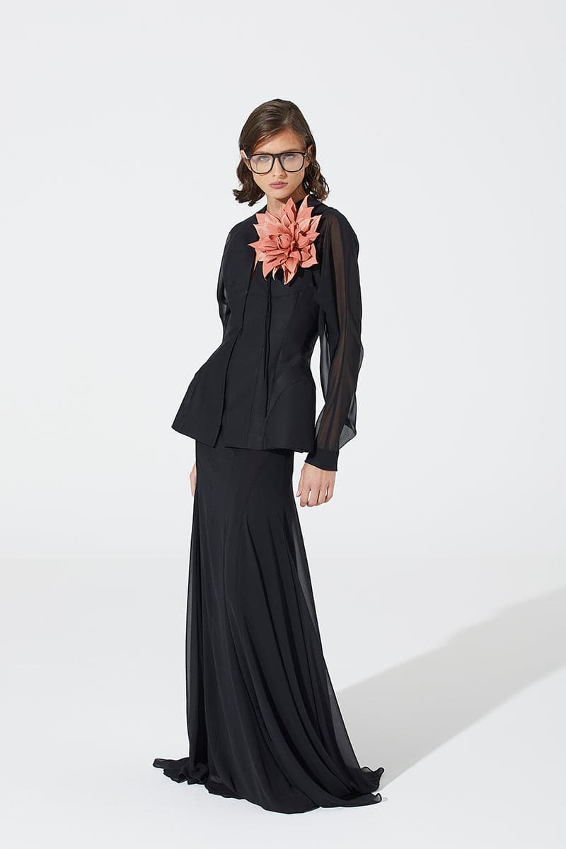 Black cutout flared top by BABUKHADIA, featuring a stylish design with cutout details and flared sleeves.