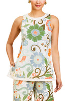 Mestiza New York Judah cropped pants in groovy floral print, styled with a Corey tunic top on a model.