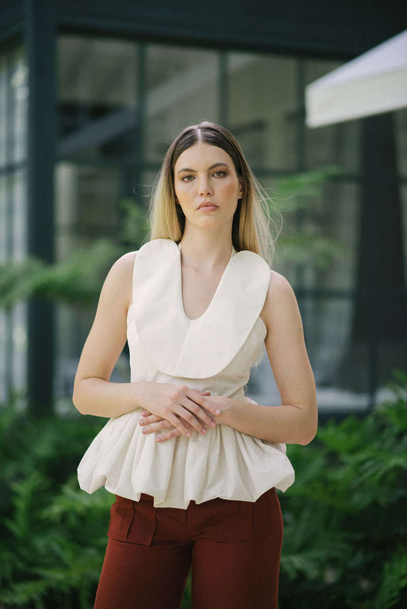 Ivory Corina blouse by ANA + MARIA, lightweight tops with a relaxed fit, shown in a stylish campaign photo.